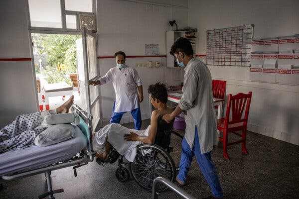A man injured in the bombing at the Kabul airport being treated at the Emergency NGO hospital last week. The W.H.O. reported the delivery of more than 12 tons of medical supplies to Afghanistan on Monday. 