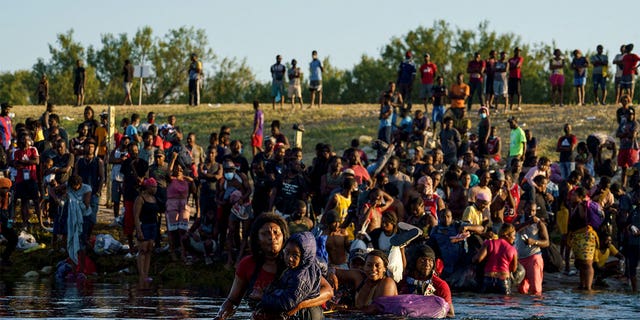Haitian migrants continue to cross across the US-Mexico border on the Rio Grande as seen from Ciudad Acuna, Coahuila state, Mexico on September 20, 2021. 