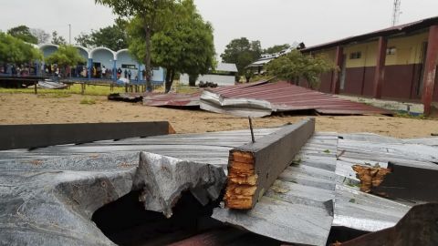 The damaged roof of a school lies in the playground in Vilanculos, Mozambique, on February 24.
