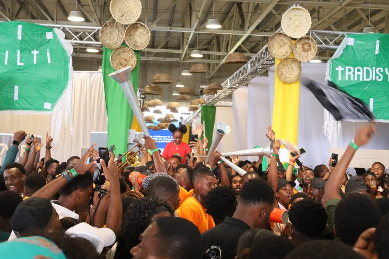 A walking band energizes Gwoup Eritaj’s Agricultural and Artisanal Resistance Fair in Pétion-Ville, Port-au-Prince, on May 1, 2025. Photo by Dieugo André for The Haitian Times.