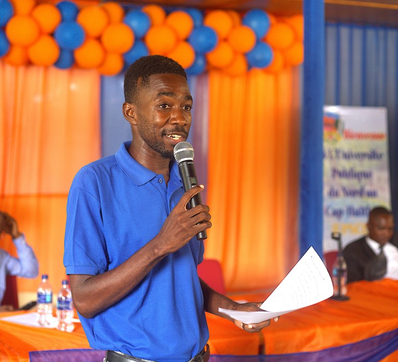 A student sharing some of his group’s ideas that could potentially tackle the gang violence crisis in Haiti. Photo by Onz Chery/ The Haitian Times.
