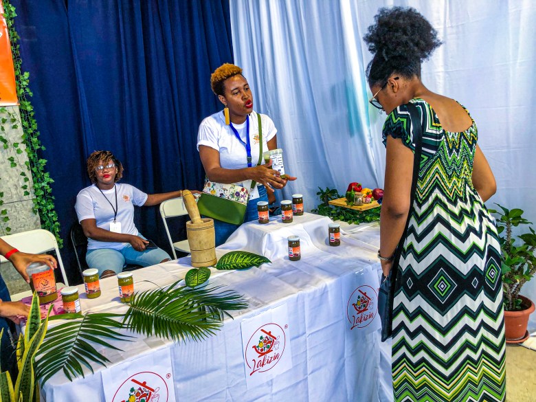 At the inaugural HAIFEX Women’s Entrepreneurship Fair in Pétion-Ville on July 6-7, 2025, a Lakizin representative demonstrated a convenient, ready-to-use seasoning blend for effortless daily cooking. Photo by Juhakenson Blaise/The Haitian Times