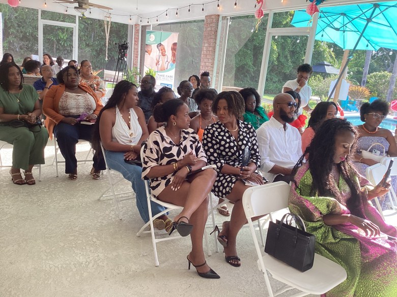 Attendees chatting during a pause at the Coral Springs book signing at Lotus Mansion, July 27, 2025. Photo by Fritznel D. Octave/The Haitian Times.