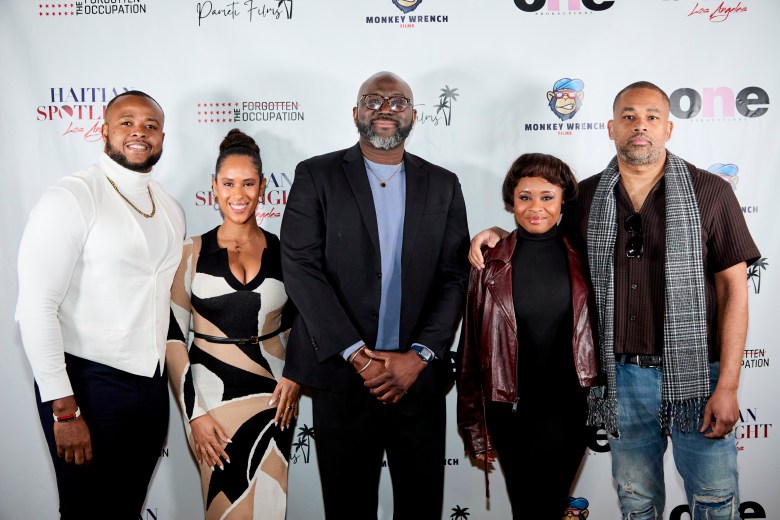 From left, Richardson Chery, Martine Harris, co-founder of Haitian Spotlight LA, producer Hans Augustave, Jess Blaise, communications director of Haitian Spotlight LA, and director Alain Martin gather at the Los Angeles premiere of “The Forgotten Occupation” on Jan. 10. Haitian Spotlight LA partnered on the screening and post-film discussion. Photo courtesy of David S. Coy II