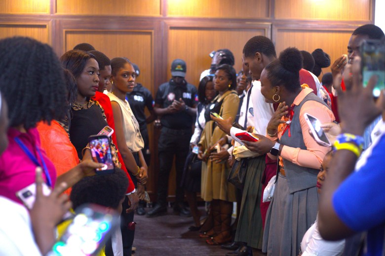 High school seniors and adults waiting for Ariana Milagro Lafond’s arrival at the April 18th welcoming ceremony at City Hall. Photo by Onz Chéry/ The Haitian Times