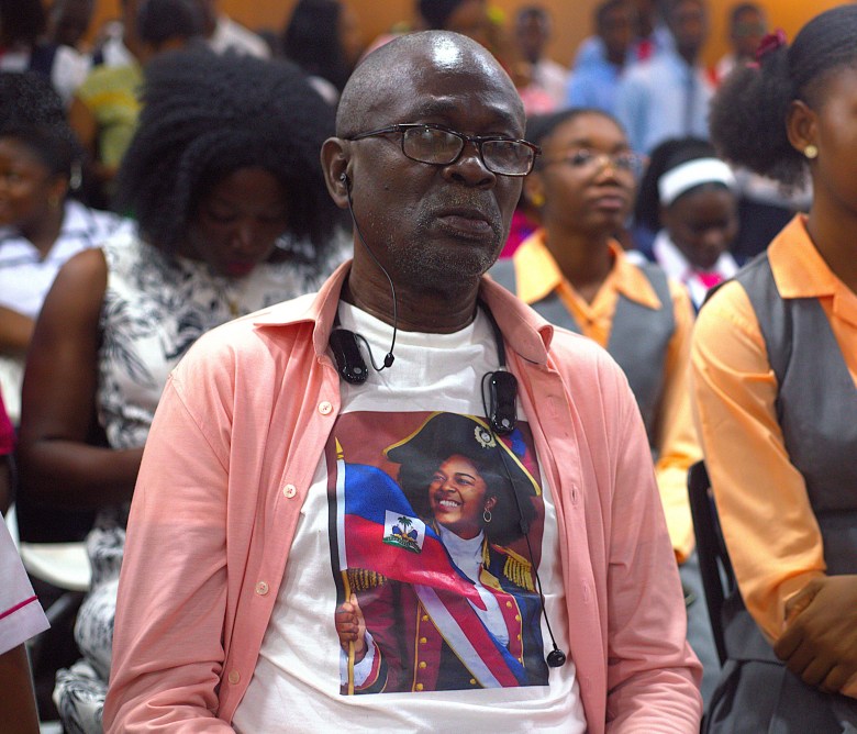 A man wearing a t-shirt with Ariana Lafond’s image on it during her homecoming ceremony. Photo by Onz Chéry/ The Haitian Times