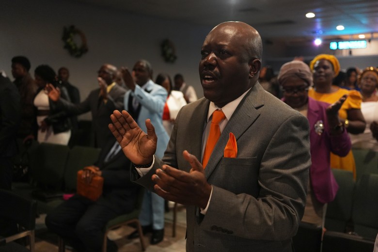 Rev. Reginald Silencieux leads a worship service at the First Haitian Evangelical Church of Springfield, Sunday, Feb. 1, 2026, in Springfield, Ohio. (AP Photo/Luis Andres Henao)