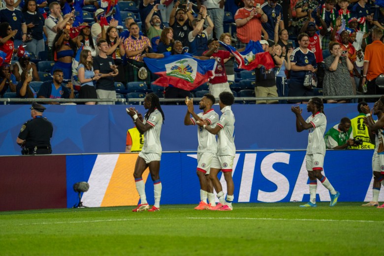 Members of Les Grenadiers acknowledge Haiti supporters in the stands during a Group C match against Scotland at the 2026 FIFA World Cup at Gillette Stadium in Foxborough, Massachusetts, on June 13, 2026. Photo by Fredner Cayemitte / The Haitian Times.