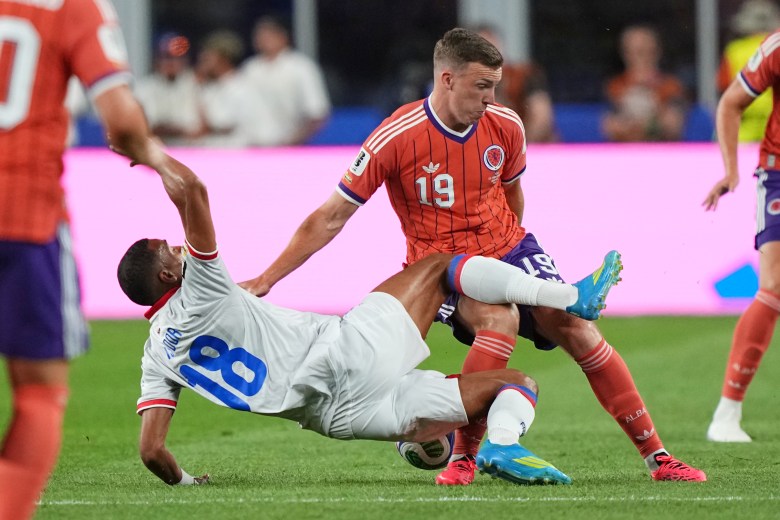 Haiti's Wilson Isidor (18) and Scotland's Lewis Ferguson (19) battle for the ball during the World Cup Group C soccer match between Haiti and Scotland in Foxborough, Mass., near Boston, Saturday, June 13, 2026. (AP Photo/Martin Meissner)