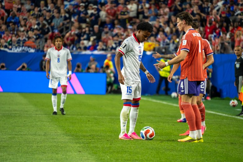 Forward Ruben Providence(15) of Les Grenadiers stands over the ball during Haiti’s Group C match against Scotland at the 2026 FIFA World Cup at Gillette Stadium in Foxborough, Massachusetts, on June 13, 2026. Photo by Fredner Cayemitte / The Haitian Times.