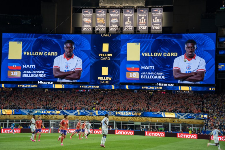 A yellow card that the Scottish fans cheered. Photo by Fredner Cayemitte/The Haitian Times