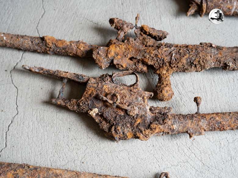 The nine antique rifles discovered in a pit in the courtyard of a church in Grande-Rivière-du-Nord, Haiti's Nord Department, were presented by the National Bureau of Ethnology (BNE) on Thursday, July 16, 2026. Photo via the BNE's Facebook page