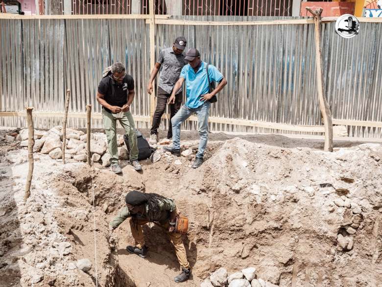 The National Bureau of Ethnology (BNE) team along with local officials and leaders during the archeological visit to view the artifacts found underneath the Conservative Baptist Church in Grande-Rivière-du-Nord on Thursday, July 16, 2026. Photo via BNE’s Facebook page