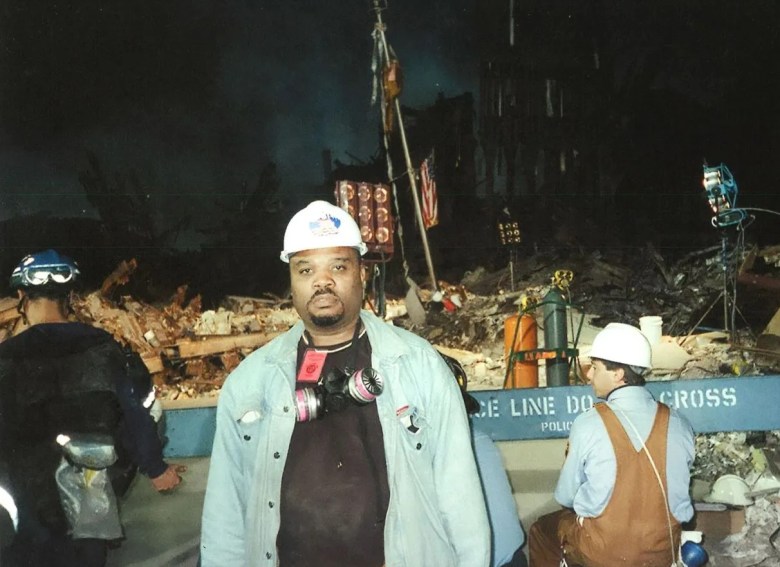 Paul Eliacin in front of the wreckage at Ground Zero, in September 2001. Courtesy: Paul Eliacin/Pololo Entertainment